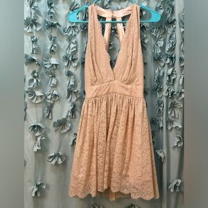 Beautiful mini with low cut. Never been worn. Still has tags